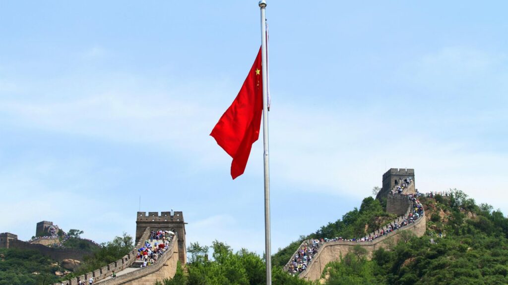 Great Wall of China with Chinese flag flying overhead