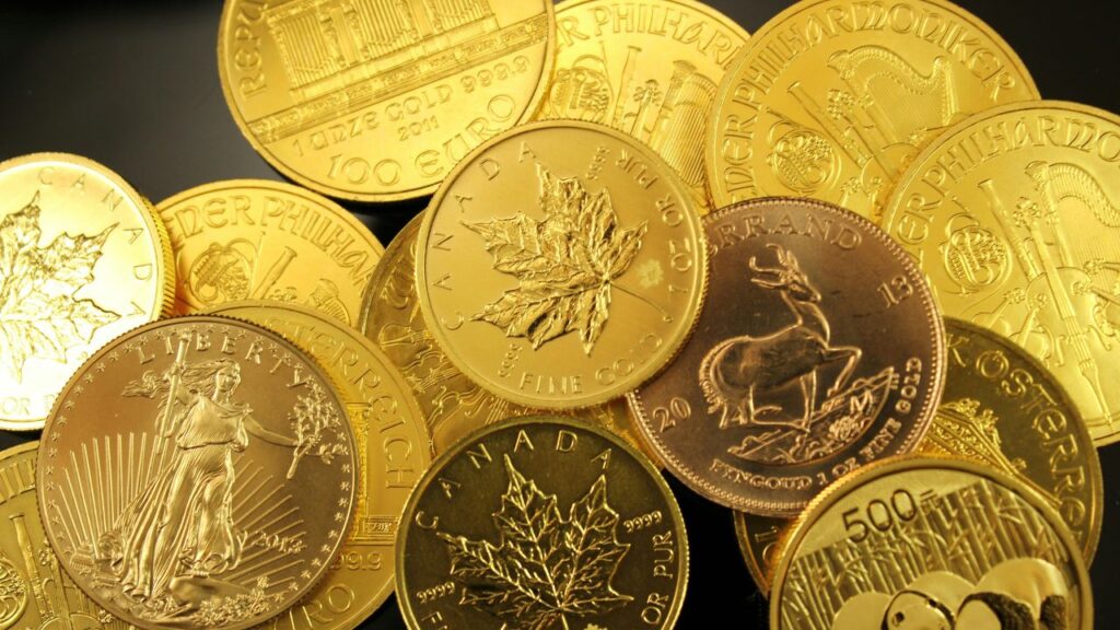 Gold coins stacked together representing gold as a store of value and inflation hedge for UK investors