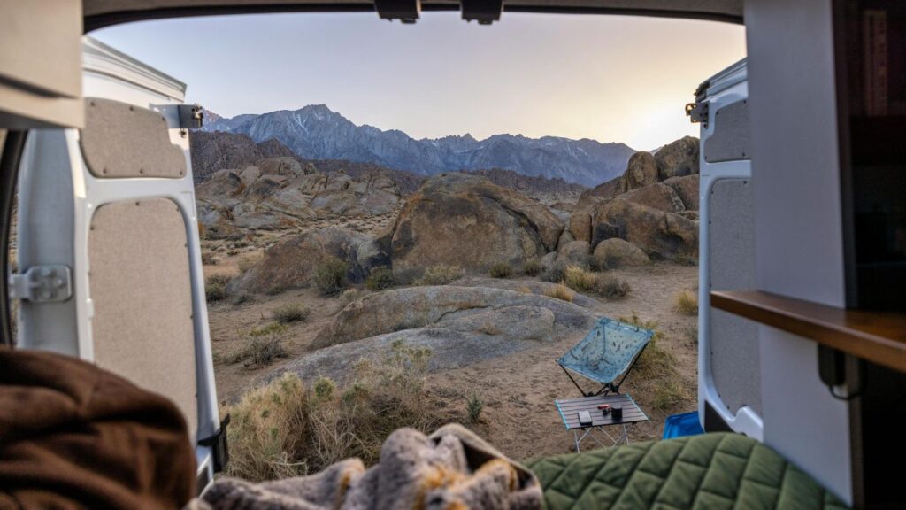 van parked in remote countryside representing financial freedom of van life