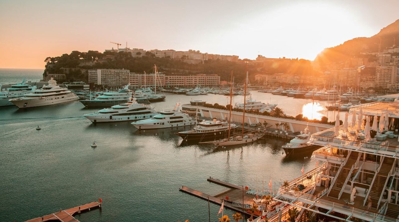 Family reviewing financial documents in monaco, planning intergenerational wealth transfer