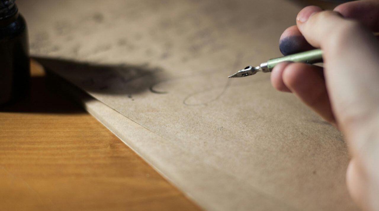Looking at legal documents, considering writing a will to protect his family and finances